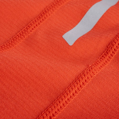 A close up of a red and orange fabric.