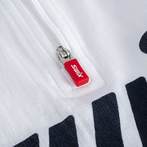 A red and white tag on a white surface.